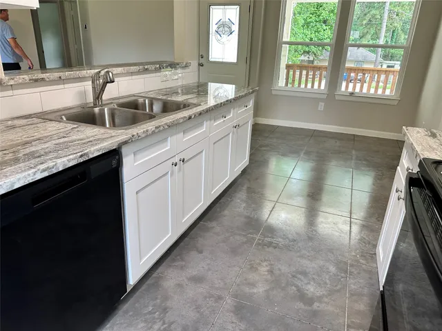 a kitchen with a sink and a window