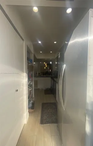 a bathroom with a glass door shower