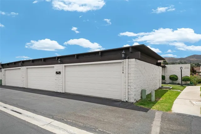 a backyard of a house with garage and garage