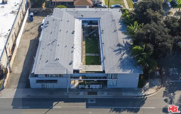 an aerial view of a house with outdoor space