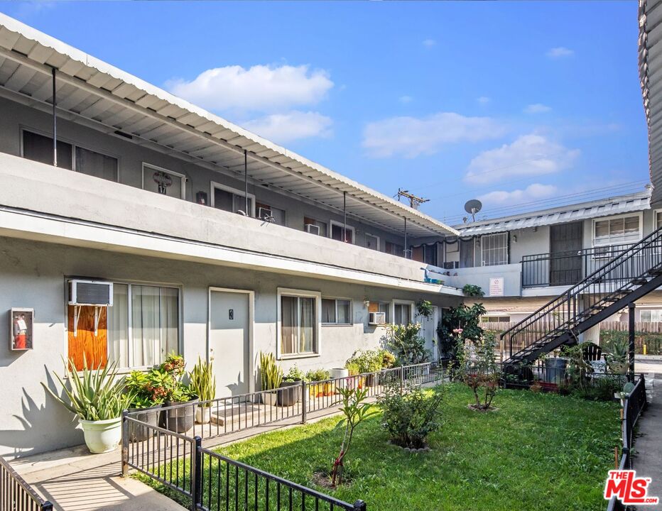 902 17th Street Santa Ana, CA 92701 - Photo 7 of 13 a front view of house and yard with green space