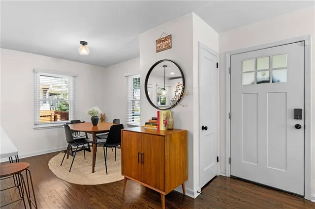 a living room with furniture a wooden floor and a window