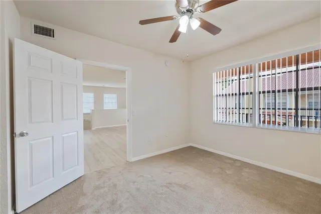 a view of an empty room with a window
