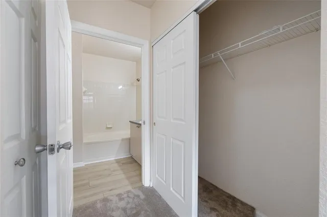 a view of a bathroom with a shower and a sink