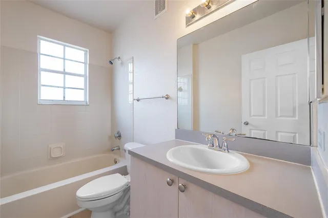 a bathroom with a sink toilet tub and shower