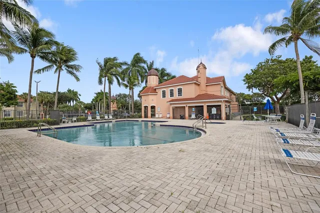 a view of outdoor space with playground and green space