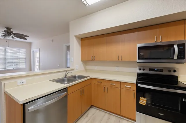 a kitchen with a sink and a microwave