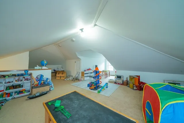 a bedroom with a bed and a table