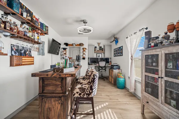 a view of a dining room with furniture and wooden floor