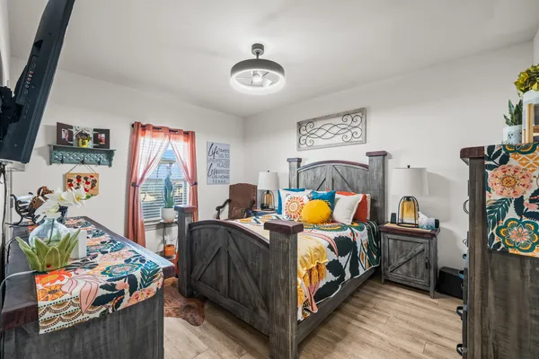 a bedroom with furniture and a baby crib