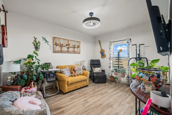 a living room with furniture and a flat screen tv