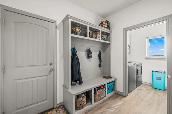 a view of an entryway with wooden floor