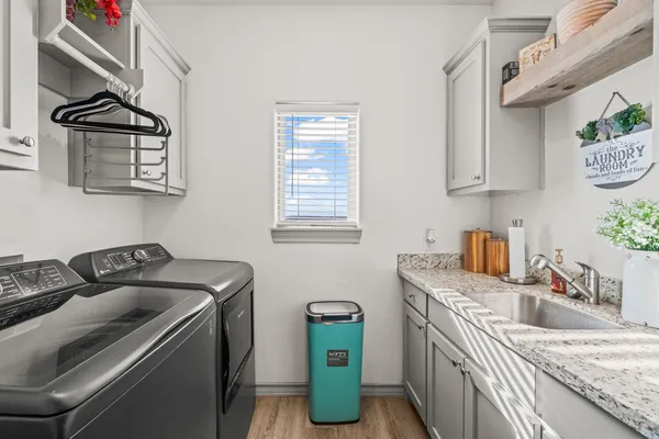a kitchen that has a sink and a stove