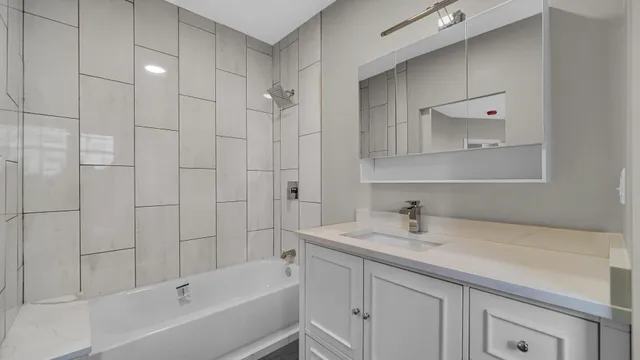 a bathroom with a bathtub and a sink