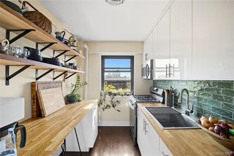 a kitchen with sink cabinets and stove