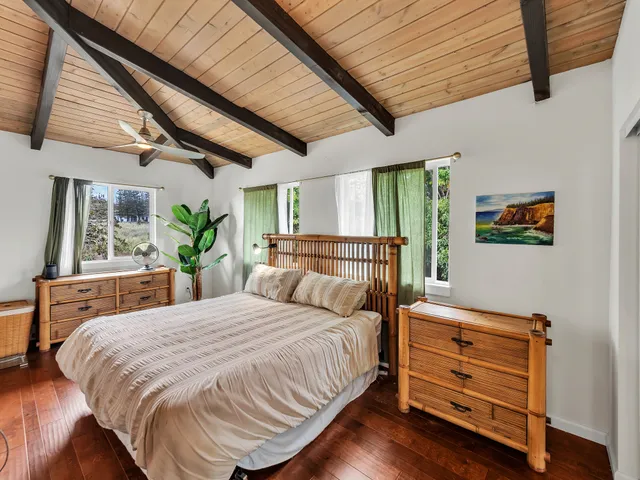 a bedroom with a bed and a dresser