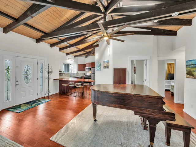 a room with lots of furniture and pool table