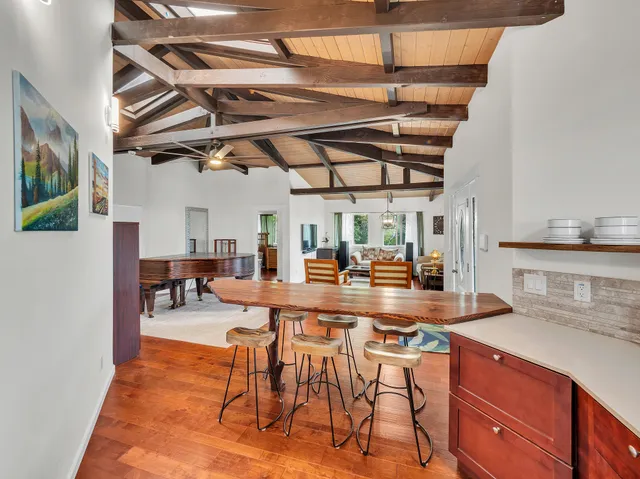 a view of a kitchen with dining table and chairs