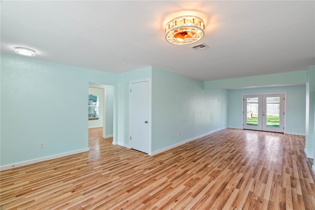 1703 Austin Street Portland, TX 78374 - Photo 2 of 13 a view of an empty room and window