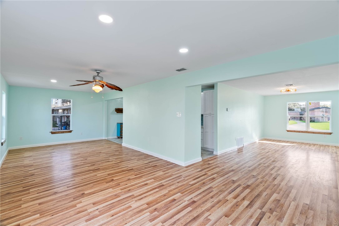 1703 Austin Street Portland, TX 78374 - Photo 3 of 13 a view of empty room with wooden floor