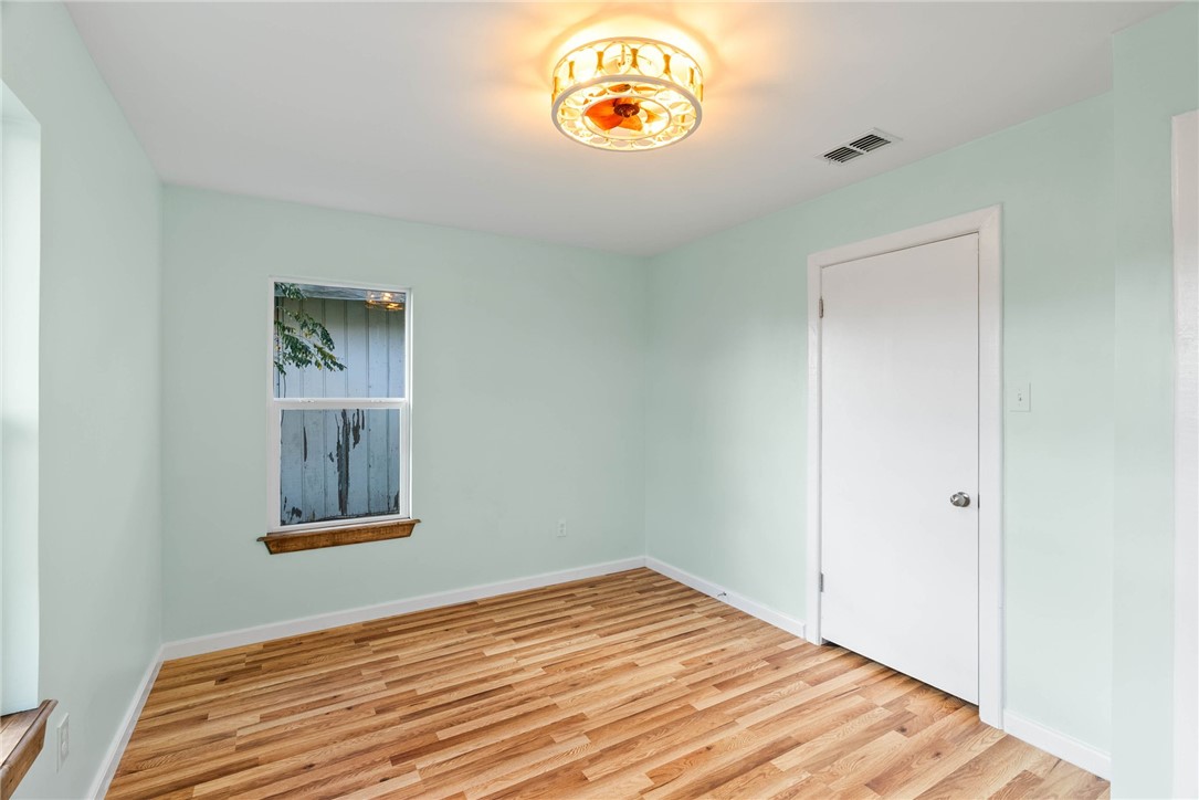 1703 Austin Street Portland, TX 78374 - Photo 5 of 13 a bedroom with a bed and a window