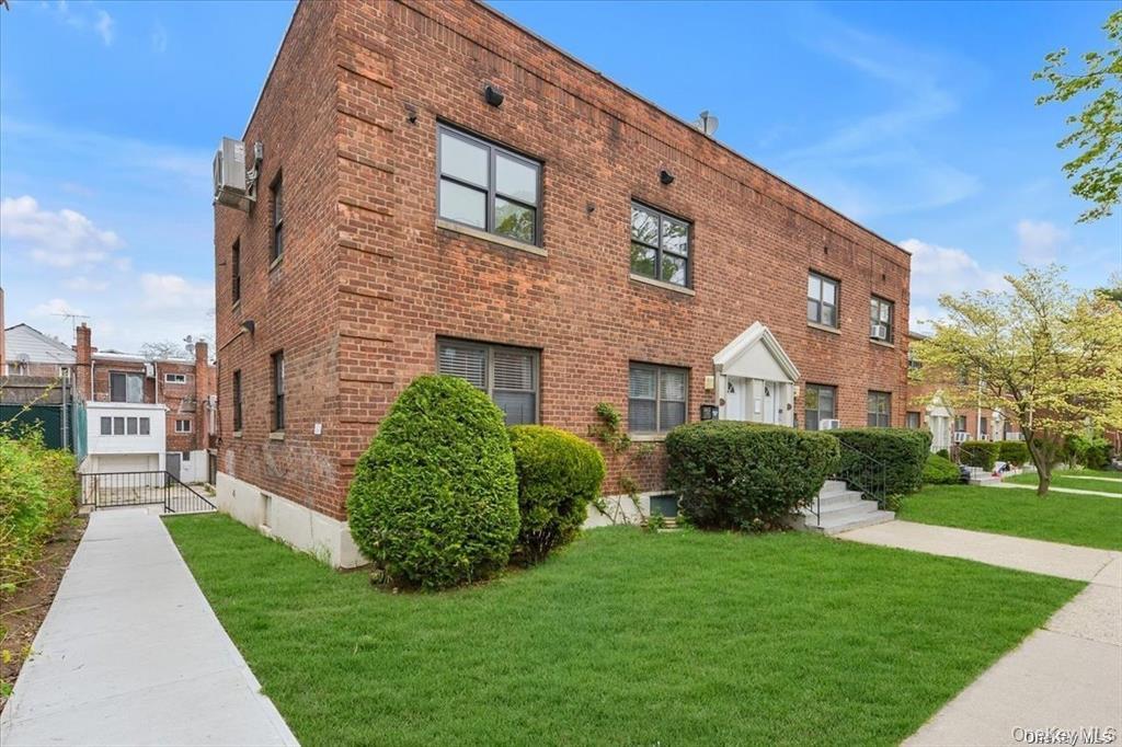 a front view of a building with garden