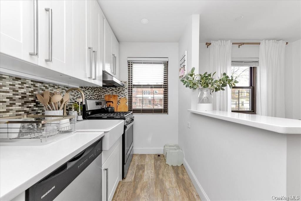 144-11 77th Road, Unit A Queens, NY 11367 - Photo 12 of 19 a kitchen with sink and cabinets