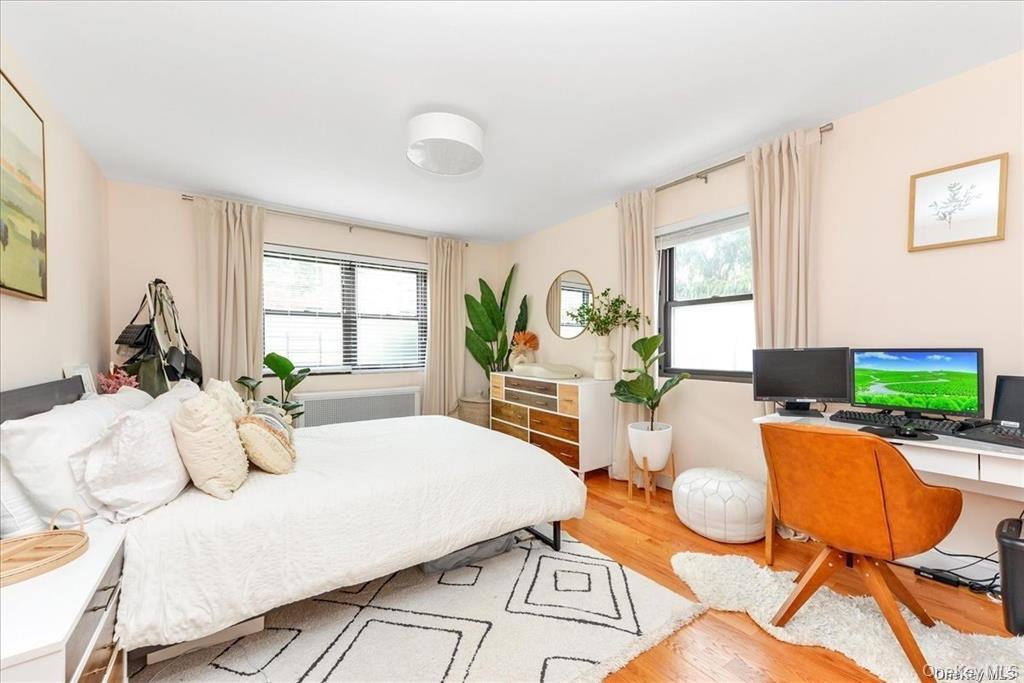 144-11 77th Road, Unit A Queens, NY 11367 - Photo 14 of 19 a living room with furniture and a flat screen tv