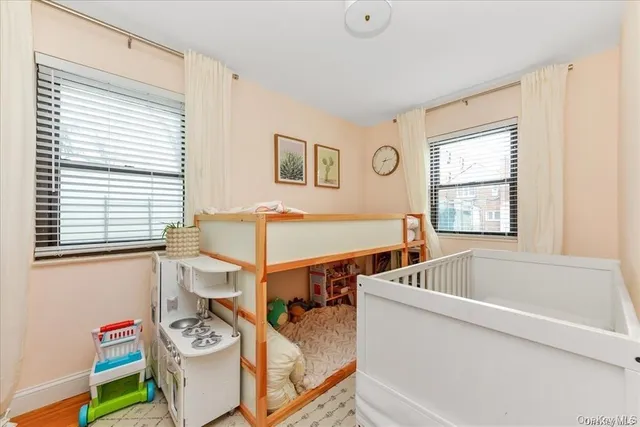 a view of a dining room with furniture and a window