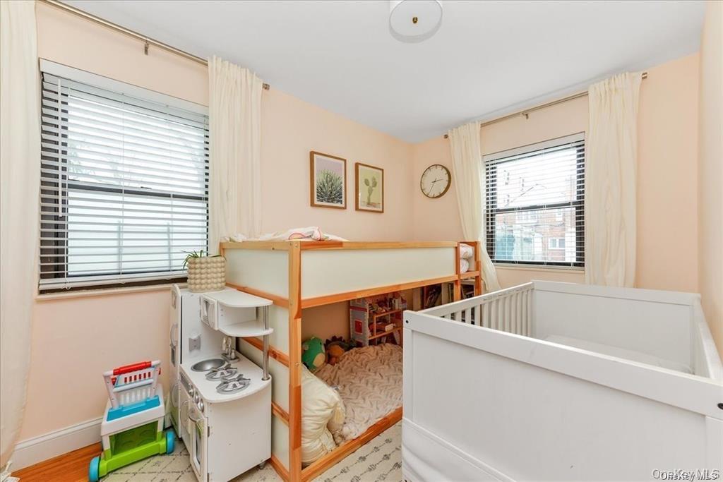 144-11 77th Road, Unit A Queens, NY 11367 - Photo 16 of 19 a view of a dining room with furniture and a window