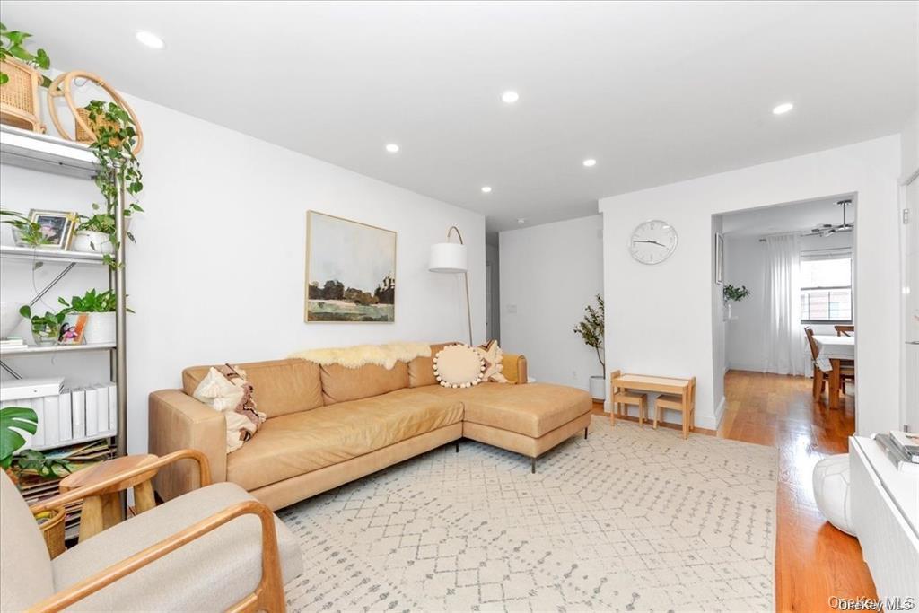 144-11 77th Road, Unit A Queens, NY 11367 - Photo 6 of 19 a living room with furniture and a couch