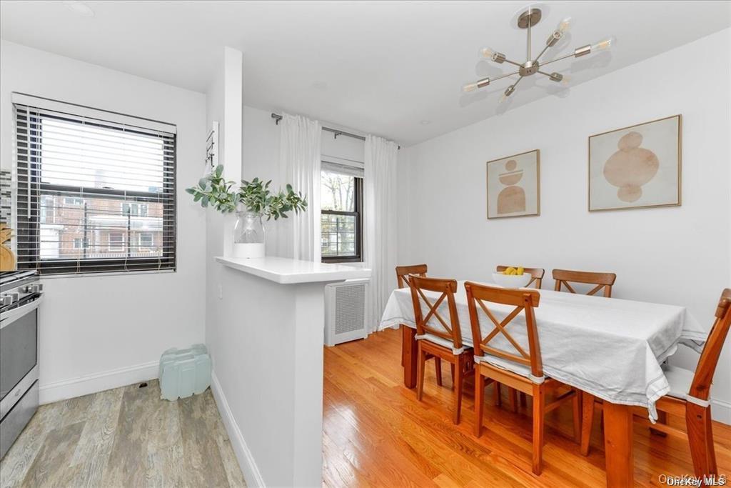 144-11 77th Road, Unit A Queens, NY 11367 - Photo 9 of 19 a workspace room with furniture and wooden floor