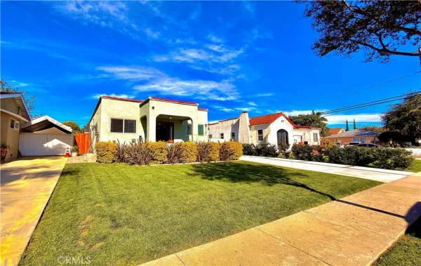 a front view of house with yard and green space