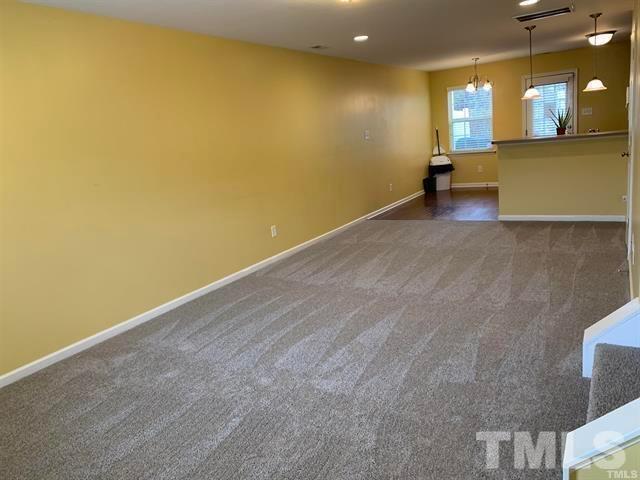 8914 Thornton Garden Lane Raleigh, NC 27616 - Photo 4 of 8 a view of a room with a large window