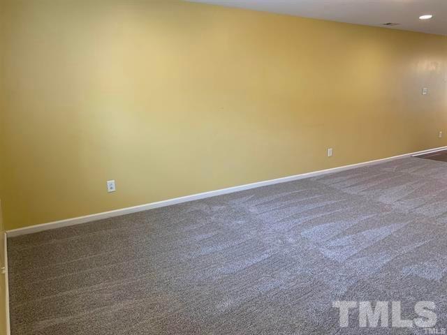 8914 Thornton Garden Lane Raleigh, NC 27616 - Photo 5 of 8 a view of an empty room