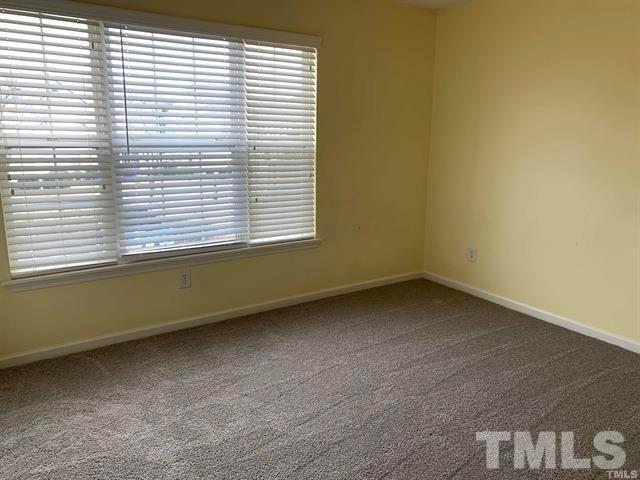 8914 Thornton Garden Lane Raleigh, NC 27616 - Photo 6 of 8 an empty room with a window