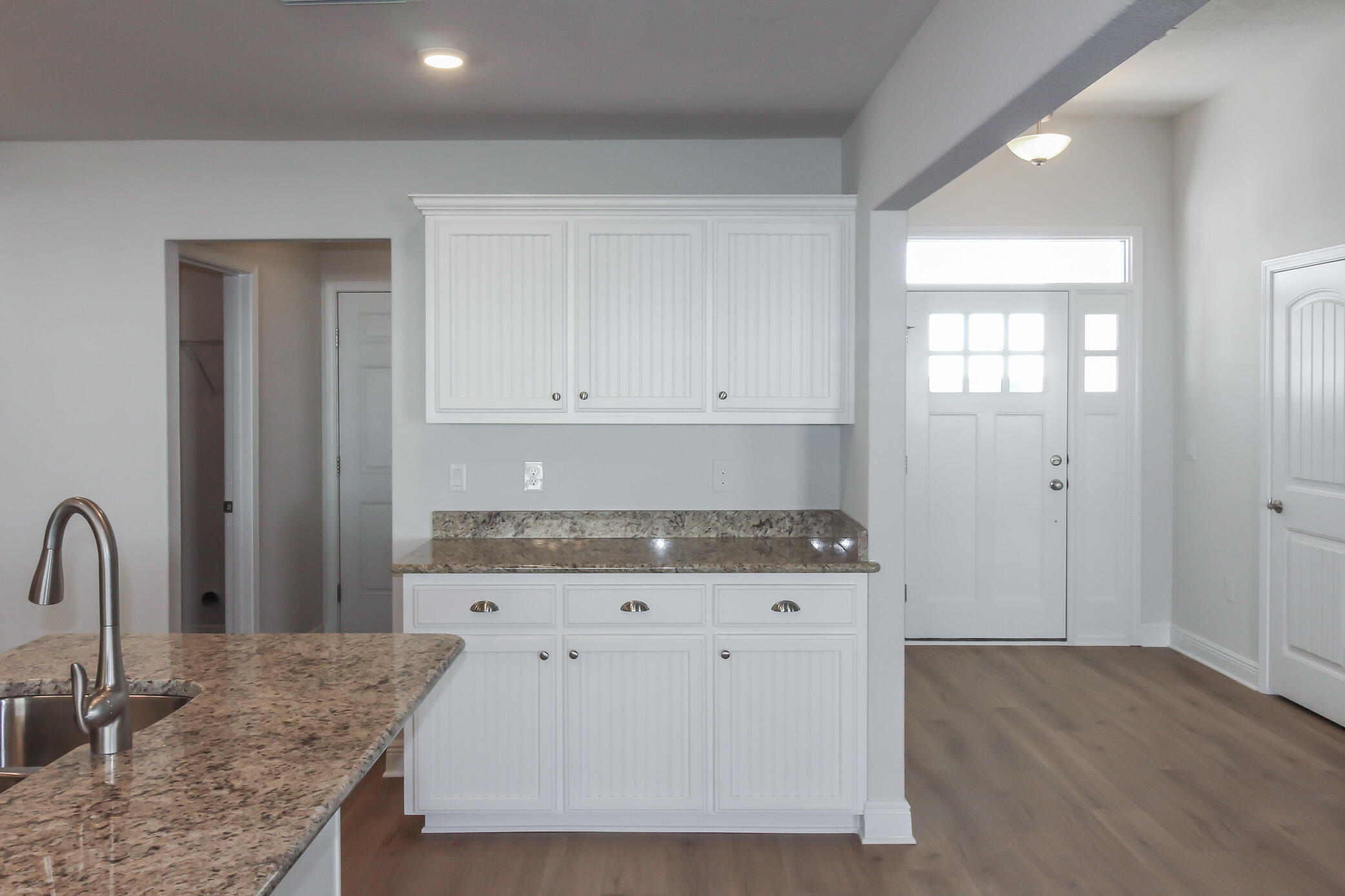 2613 Prominence Lane Crestview, FL 32536 - Photo 12 of 20 a kitchen with granite countertop a stove and a sink