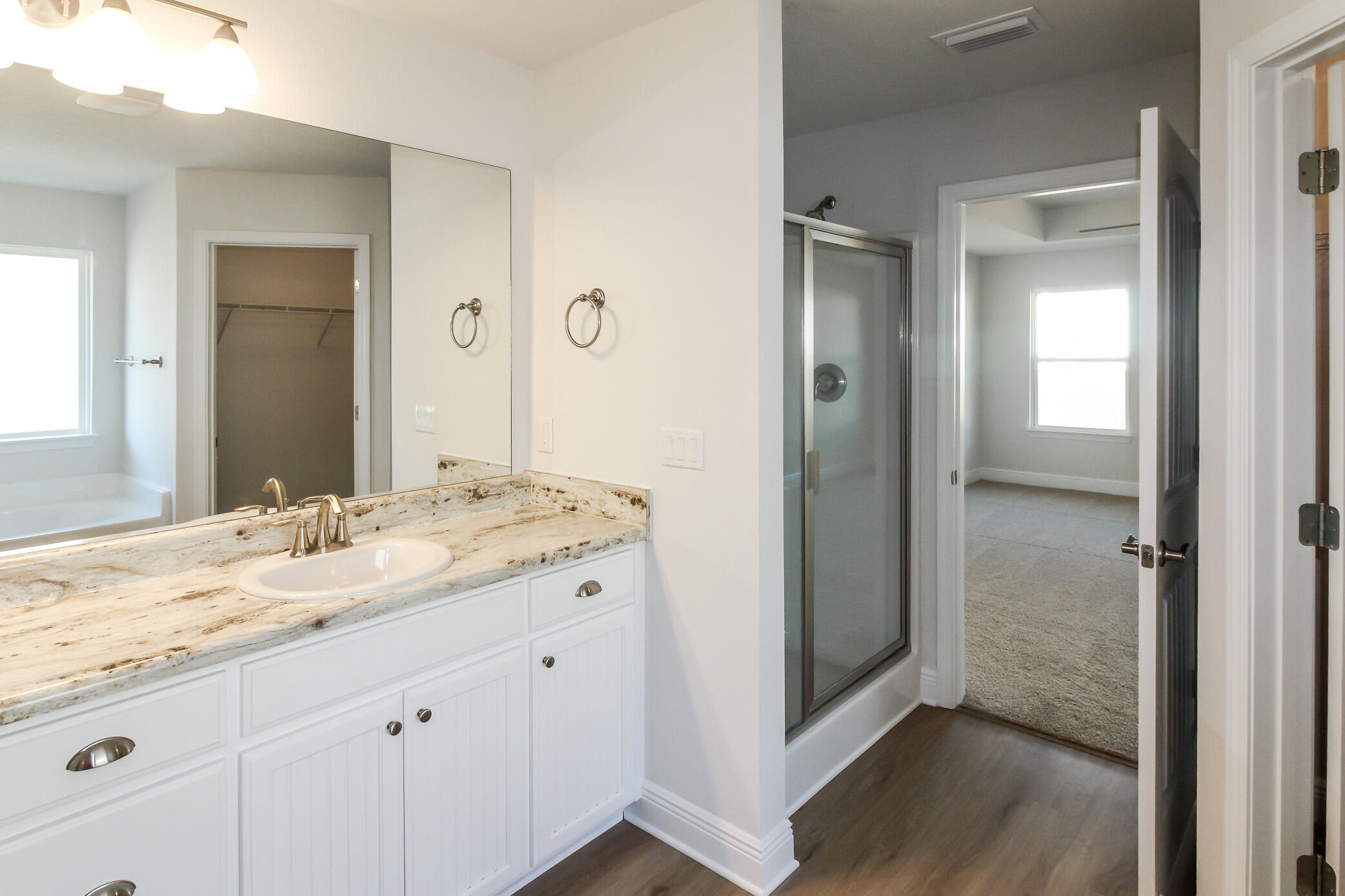 2613 Prominence Lane Crestview, FL 32536 - Photo 16 of 20 a bathroom with a granite countertop sink and a mirror