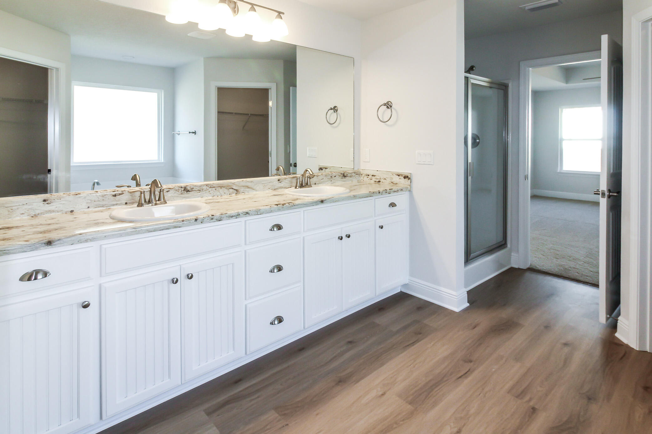 2613 Prominence Lane Crestview, FL 32536 - Photo 17 of 20 a bathroom with a granite countertop sink and mirror