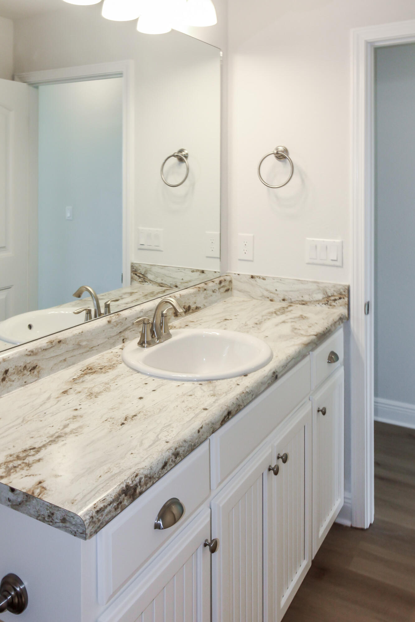 2613 Prominence Lane Crestview, FL 32536 - Photo 4 of 20 a bathroom with a granite countertop sink and a mirror