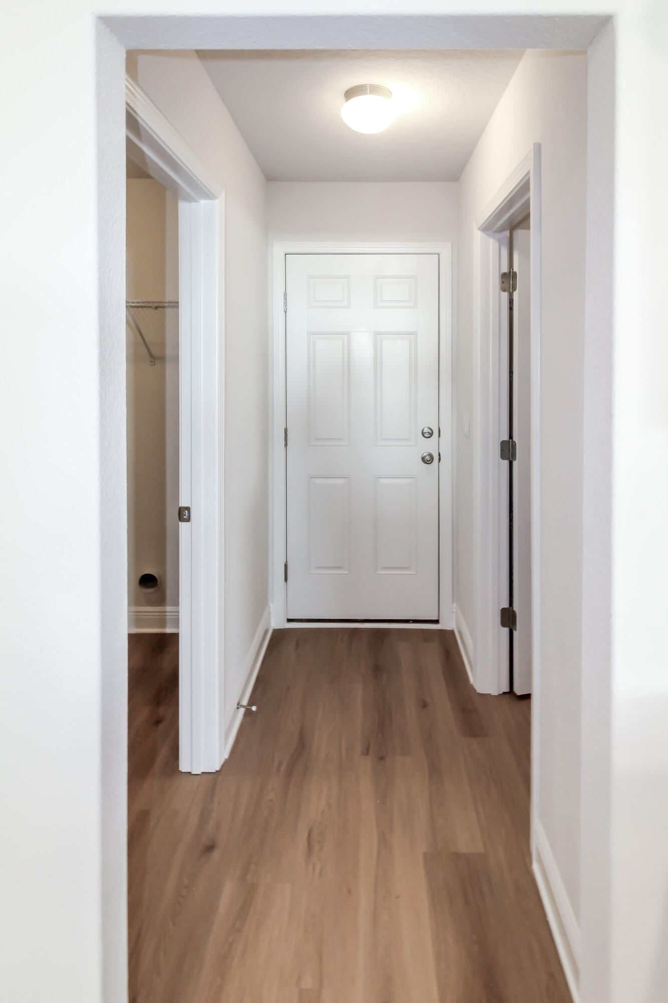 2613 Prominence Lane Crestview, FL 32536 - Photo 7 of 20 a view of a hallway with wooden floor