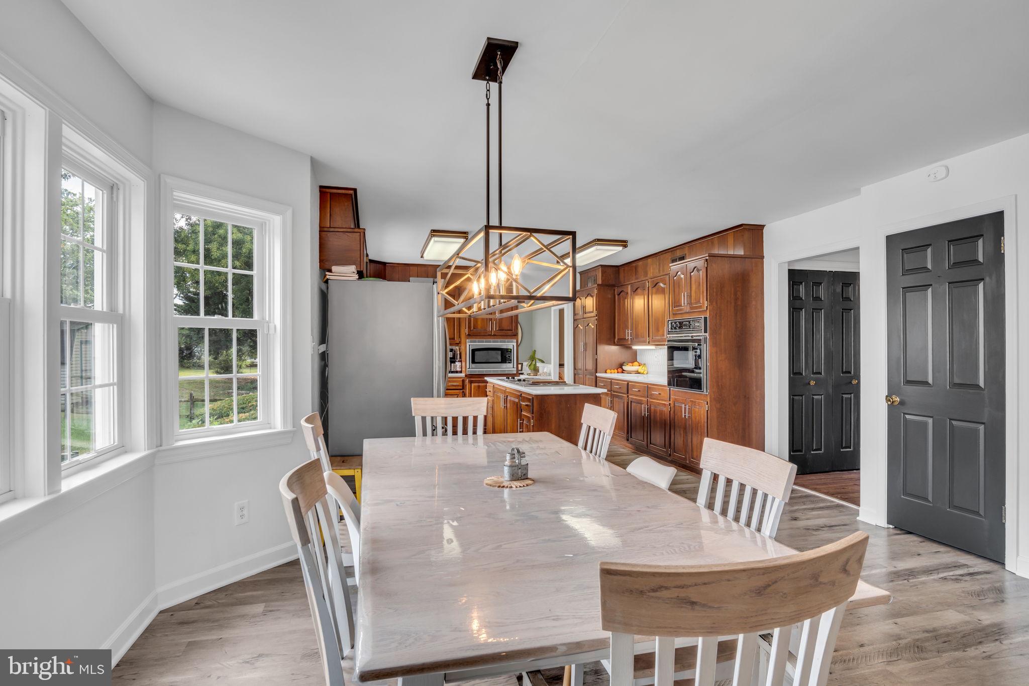 2242 Scotland Road Chambersburg, PA 17201 - Photo 15 of 63 a dining room with furniture a chandelier and window