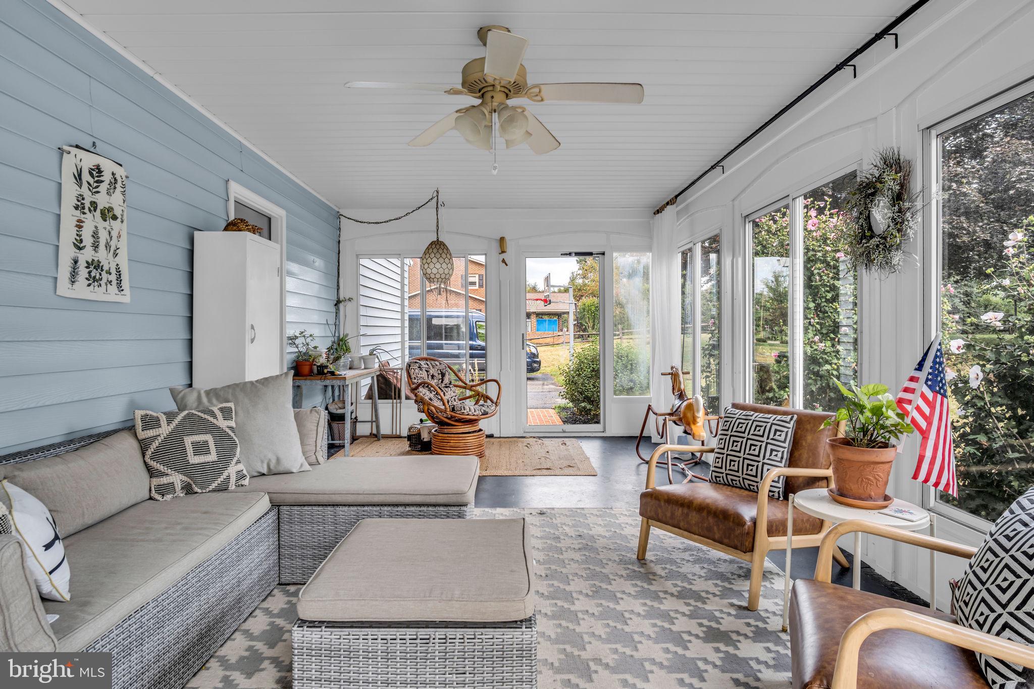 2242 Scotland Road Chambersburg, PA 17201 - Photo 20 of 63 a living room with patio furniture and a large window