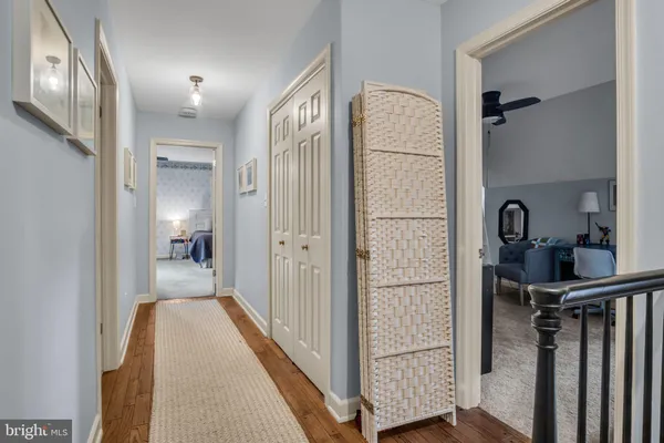 a view of a hallway with a wooden door