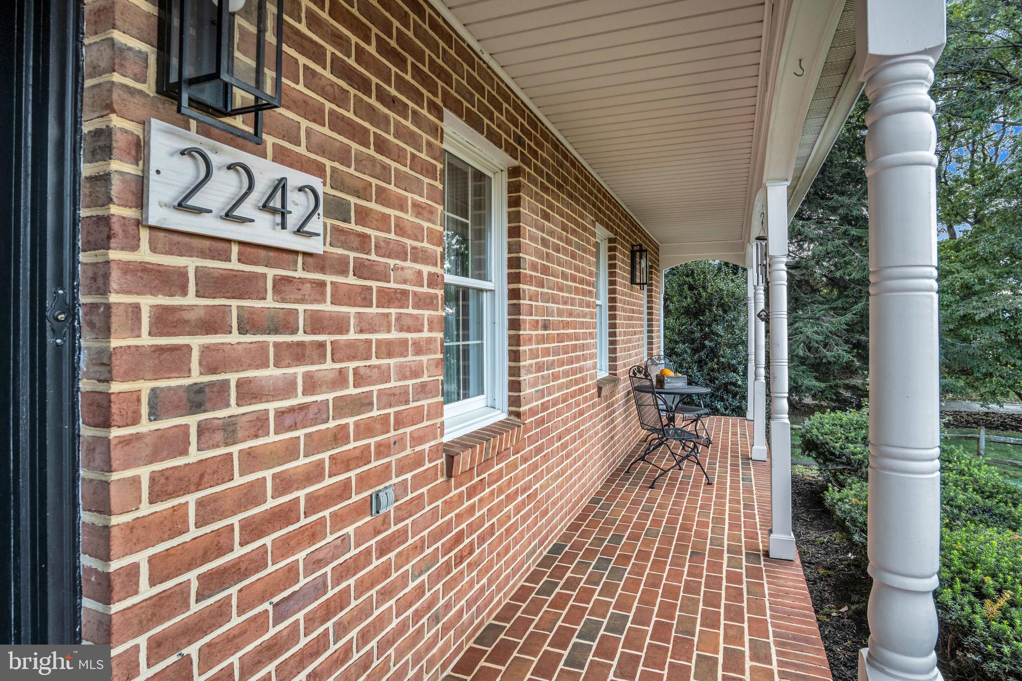 2242 Scotland Road Chambersburg, PA 17201 - Photo 3 of 63 a view of a patio with table and chairs and wooden floor