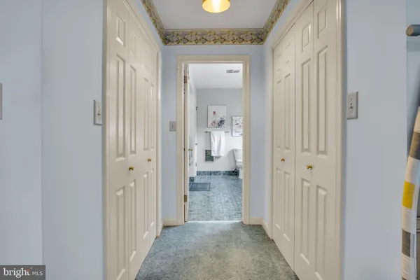 a bedroom with furniture and a chair