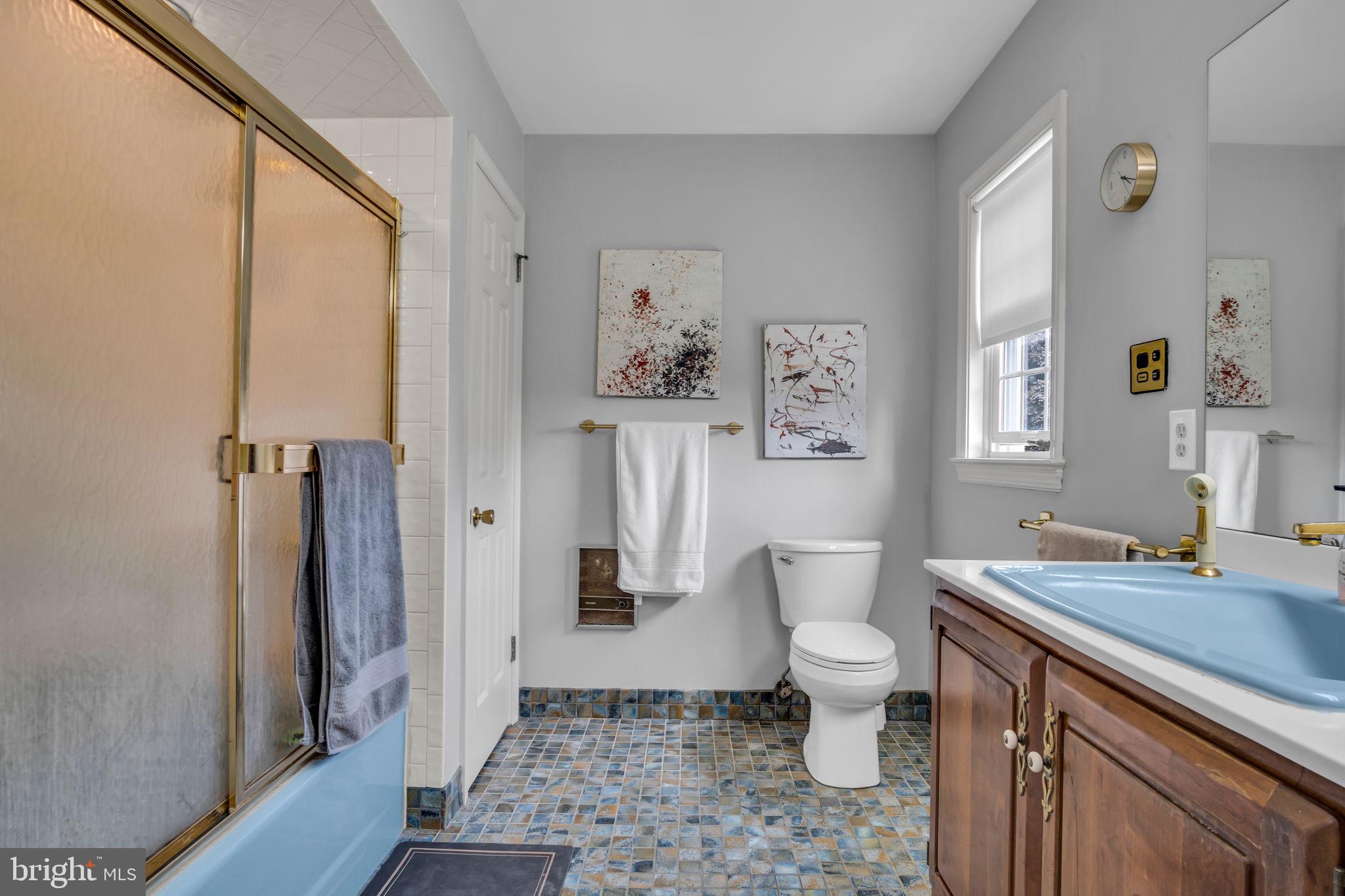 2242 Scotland Road Chambersburg, PA 17201 - Photo 35 of 63 a bathroom with a sink a toilet a mirror and shower