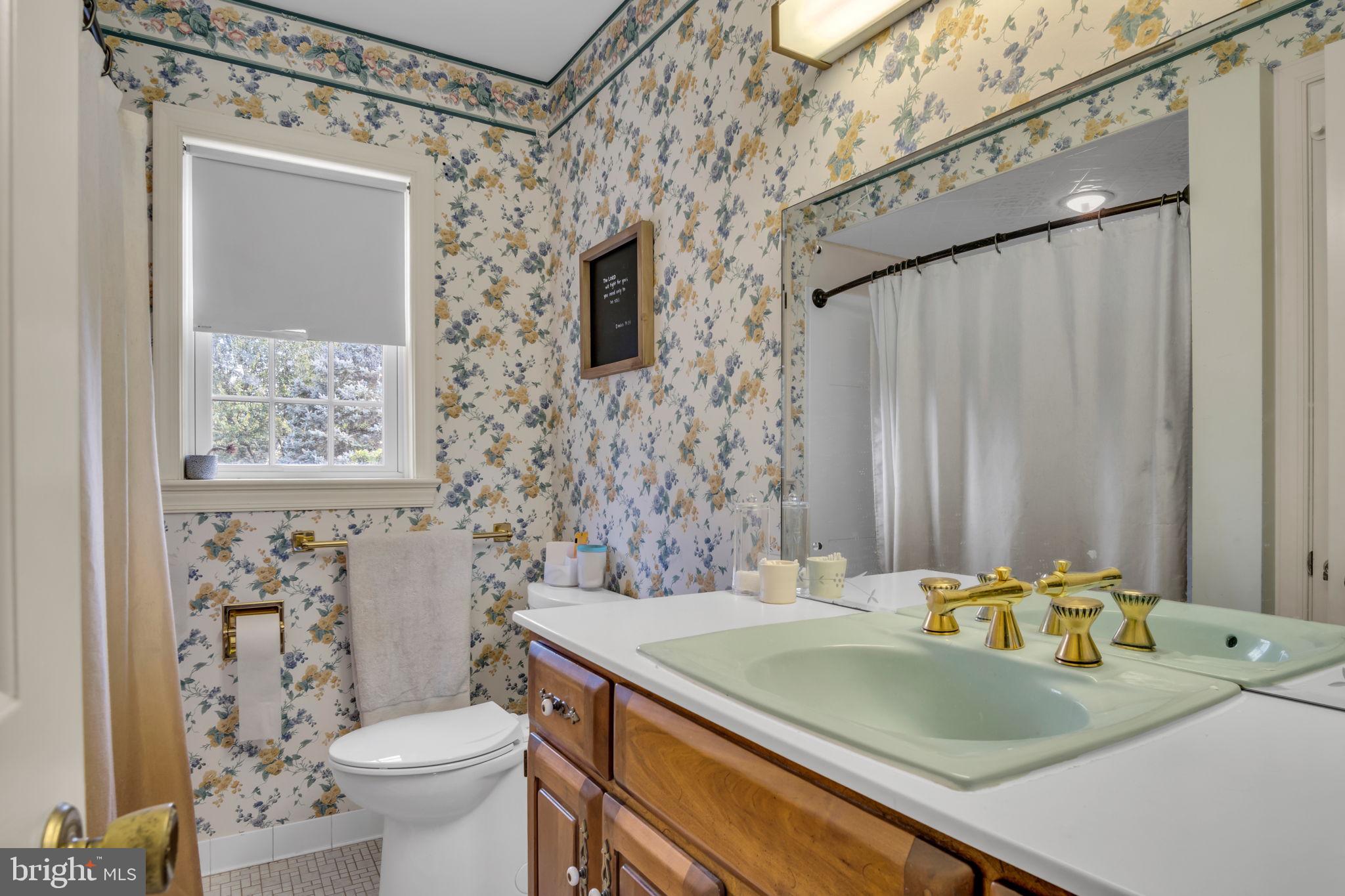 2242 Scotland Road Chambersburg, PA 17201 - Photo 37 of 63 a bathroom with a granite countertop sink a toilet and a shower