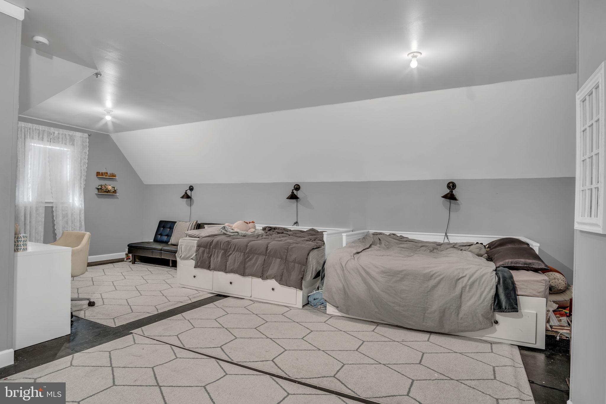 2242 Scotland Road Chambersburg, PA 17201 - Photo 41 of 63 a bedroom with bed and a couch