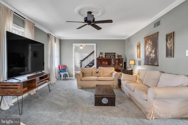 a dining room with wooden floor and breakfast area